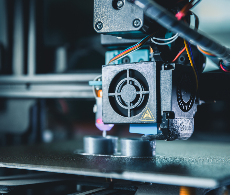 3D printer in action, creating object.